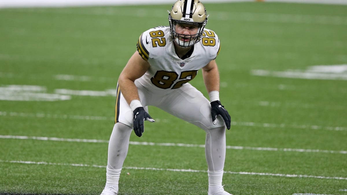 New Orleans Saints tight end Adam Trautman (82) gets tackled after a  reception during an NFL preseason game against the Houston Texans on  Saturday, August 13, 2022, in Houston. (AP Photo/Matt Patterson