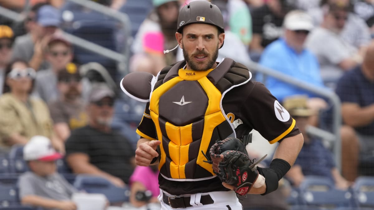 San Diego Padres catcher Austin Nola adjusts his helmet as he