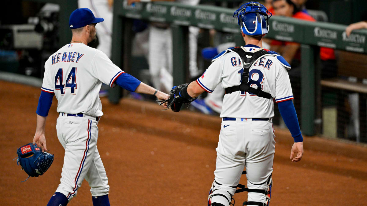 Texas Rangers catcher Mitch Garver (18) poses for a photo with