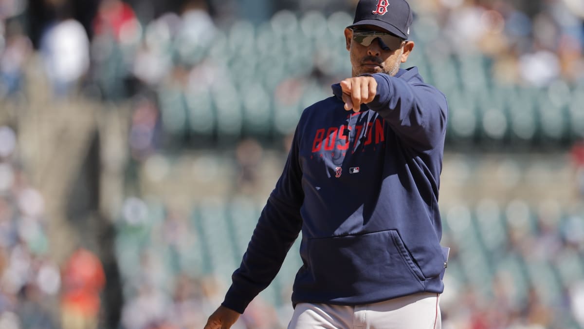 Manager Alex Cora of the Boston Red Sox looks on from the dugout