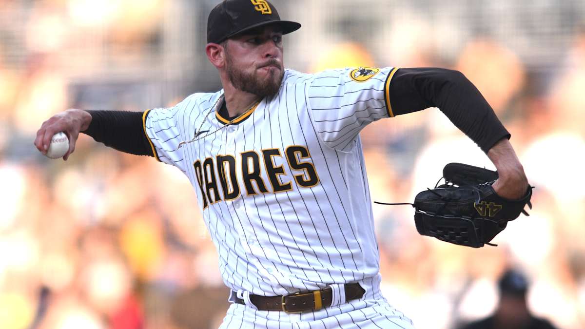 San Diego Padres' Joe Musgrove takes the field in a San Diego State  basketball jersey during warmups before a baseball game against the  Colorado Rockies in San Diego, Friday, March 31, 2023. (