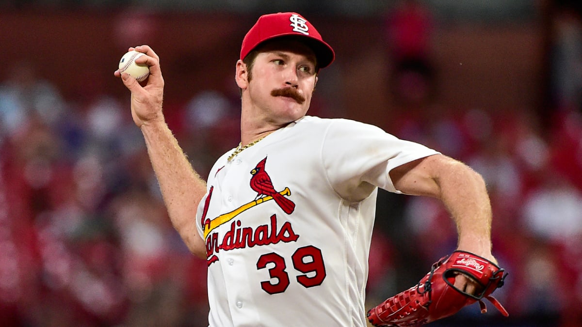 The socks and cleats worn by St. Louis Cardinals' Miles Mikolas are seen as  he throws during a baseball game against the Cincinnati Reds in Cincinnati,  Thursday, May 25, 2023. (AP Photo/Aaron