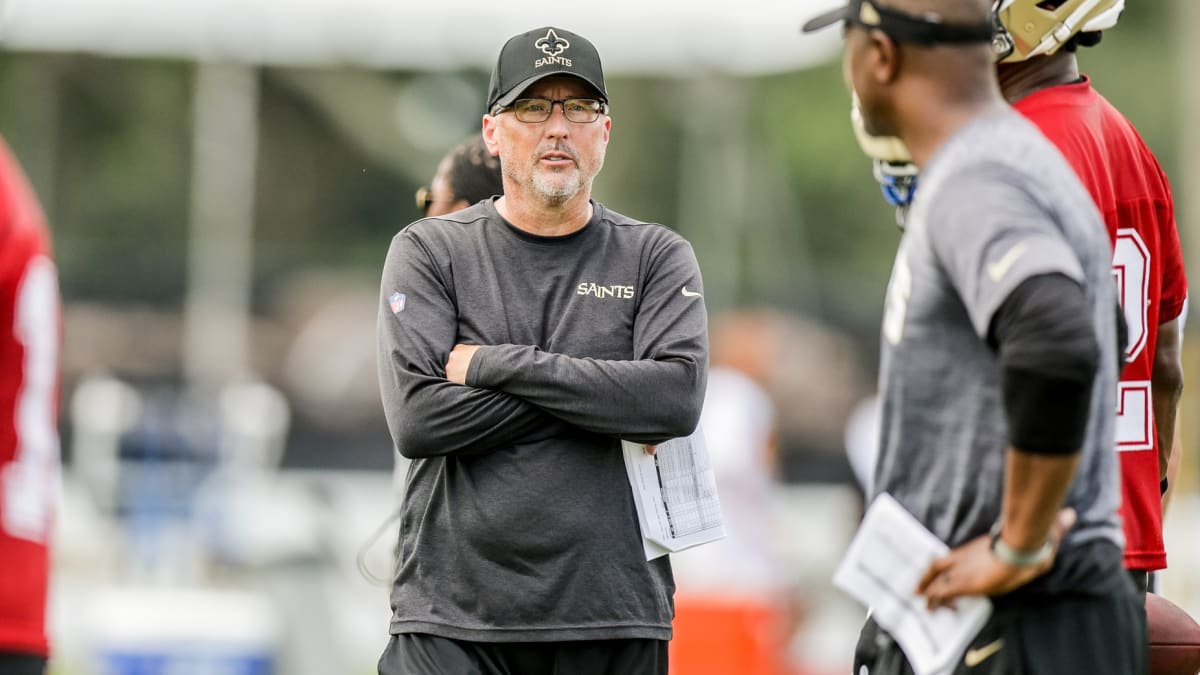 New Orleans, USA. August 13, 2023: New Orleans Saints Offensive Coordinator  Pete Carmichael looks up at the video board for a replay during NFL  pre-season game action between the New Orleans Saints