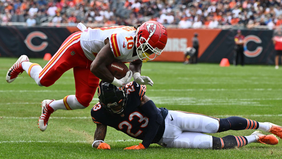 Kansas City Chiefs running back Isiah Pacheco (left) exchanges his