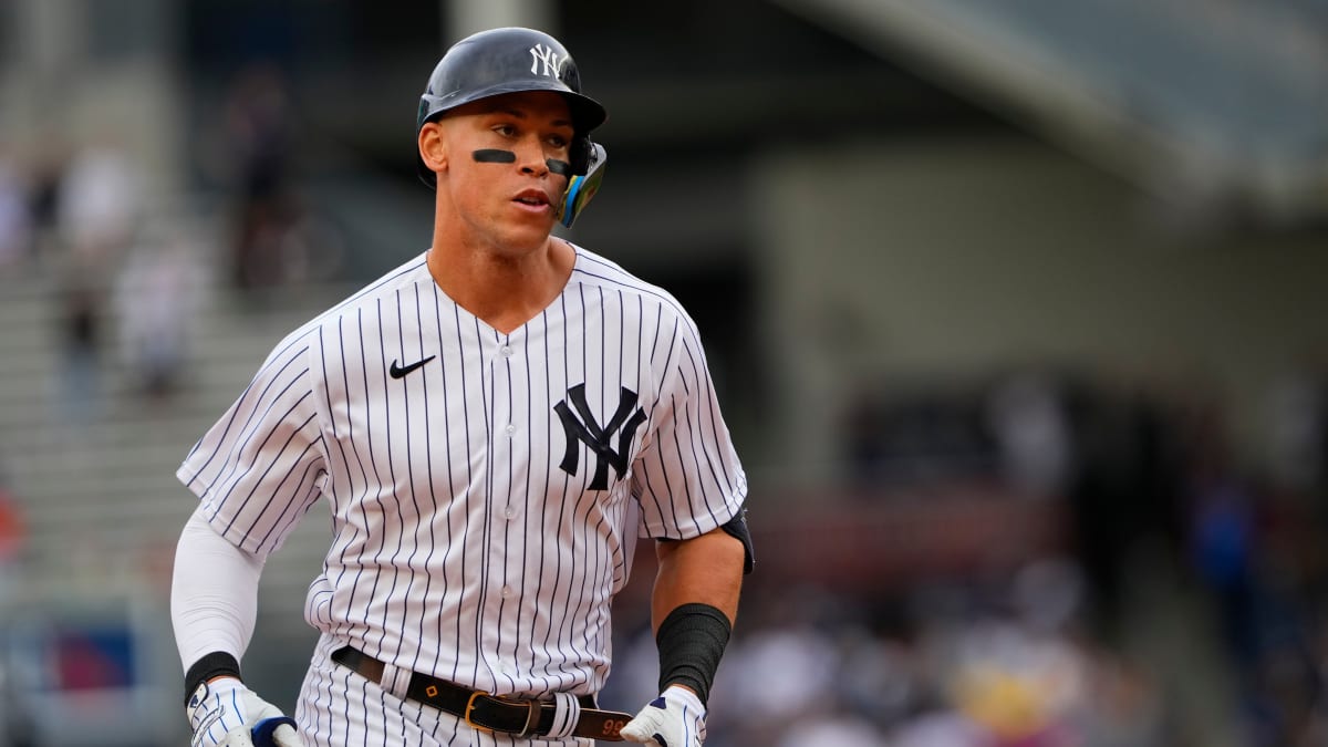 Aaron Judge says that his photo with Red Sox shirt is from when he played  in Cape Cod league, and his host family, big Red Sox fans, provided it to  him. He