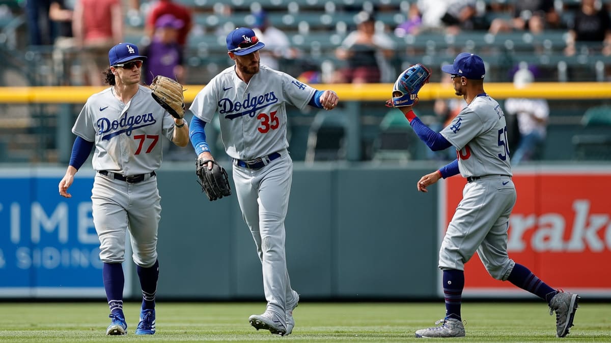 Los Angeles, United States. 29th Aug, 2021. Los Angeles Dodgers' Mookie  Betts (50) and Max Muncy (R) celebrate with teammate Cody Bellinger (35)  after scoring on catcher Will Smith's go-ahead, two-run single