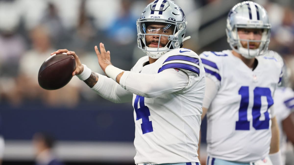 Dallas Cowboys quarterback Cooper Rush (10) hands the ball off