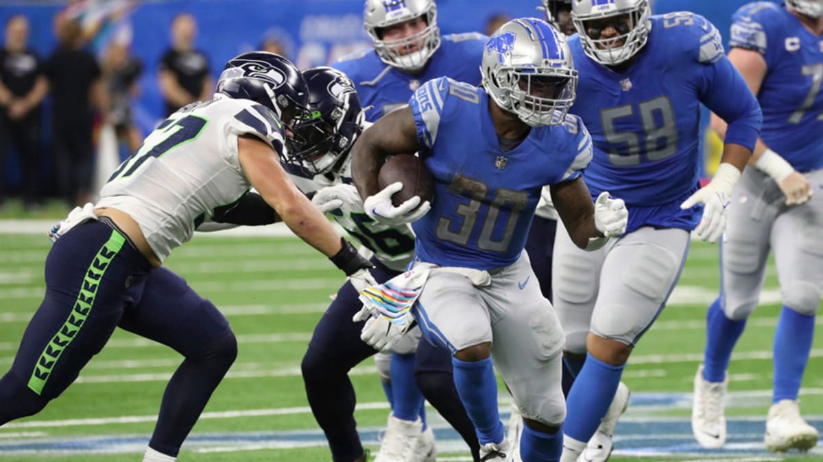 Detroit Lions running back Jamaal Williams runs with teh ball during an NFL  football game against the Seattle Seahawks, Sunday, Jan. 2, 2022, in  Seattle. The Seahawks won 51-29. (AP Photo/Stephen Brashear