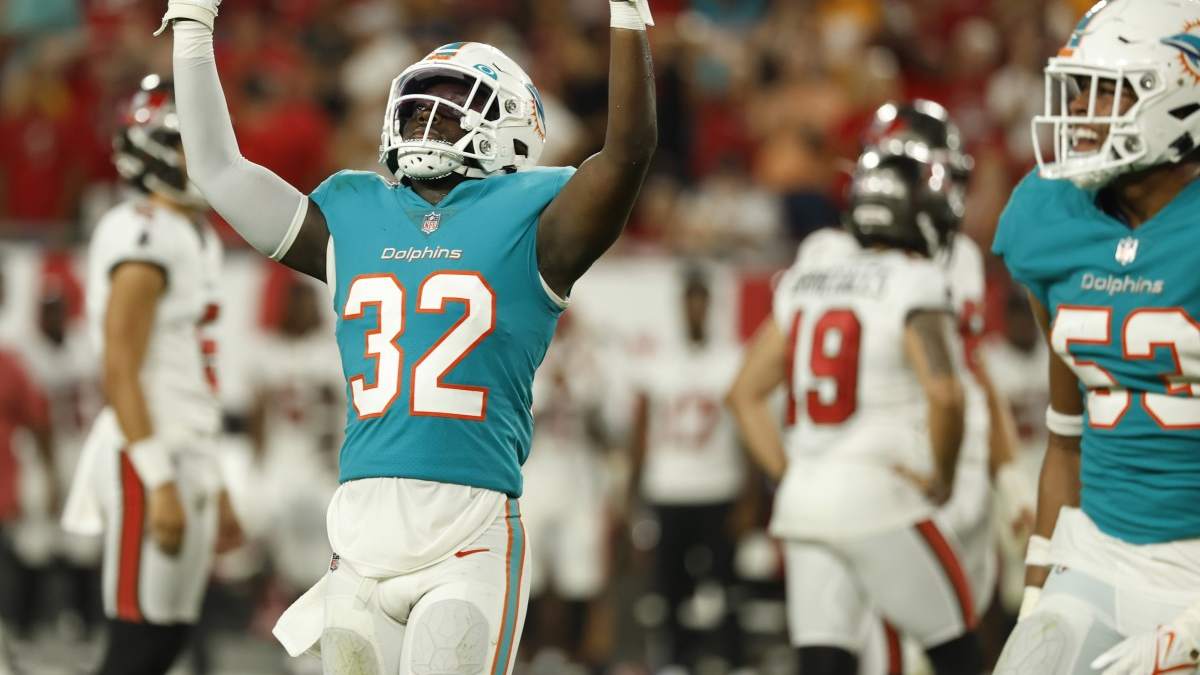 Miami Dolphins safety Verone McKinley III adjusts his helmet as he waits to  go out on the field before the start of an NFL preseason football game  against the Las Vegas Raiders