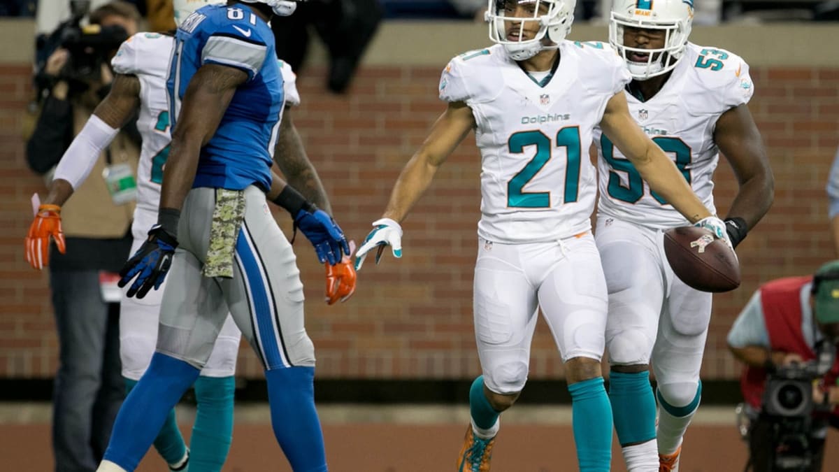 DETROIT, MI - OCTOBER 30: Miami Dolphins Cornerback (25) Xavien Howard hits  Detroit Lions Wide Receiver (14) Amon-Ra St. Brown hard during the game  between Miami Dolphins and Detroit Lions on October