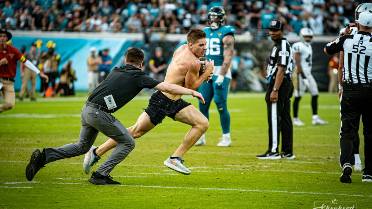 Fan causes a spill running onto field at Jaguars game