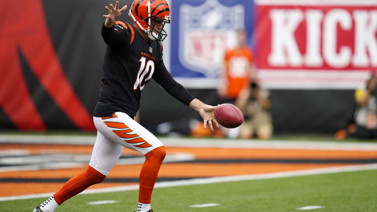 Cincinnati Bengals punter Drue Chrisman (4) warms up on the