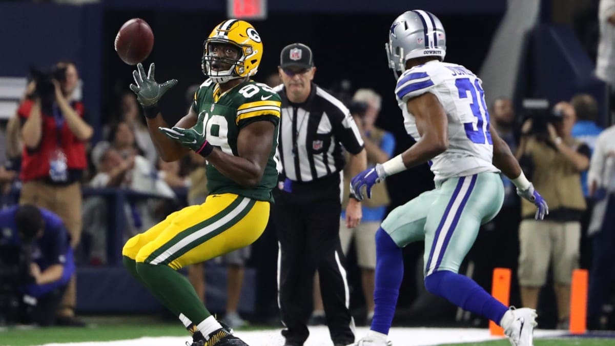 Green Bay Packers safety Rudy Ford (20) celebrates intercepting a Dallas  Cowboys quarterback Dak Prescott pass during the first half of an NFL  football game Sunday, Nov. 13, 2022, in Green Bay