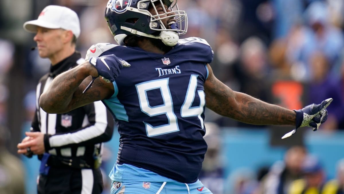 Tennessee Titans cornerback Terrance Mitchell (39) intercepts a pass by  Denver Broncos quarterback Russell Wilson during the second half of an NFL  football game Sunday, Nov. 13, 2022, in Nashville, Tenn. (AP