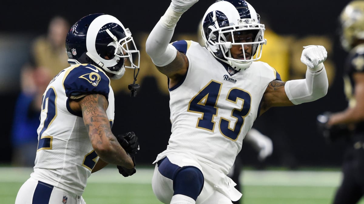 LA Rams safety John Johnson and cheerleaders hit the field with Hawaii youth