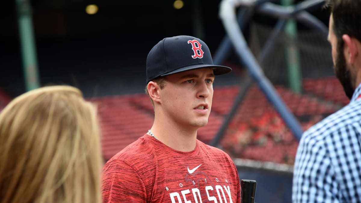 Baseball Player in Plaid Shirt.