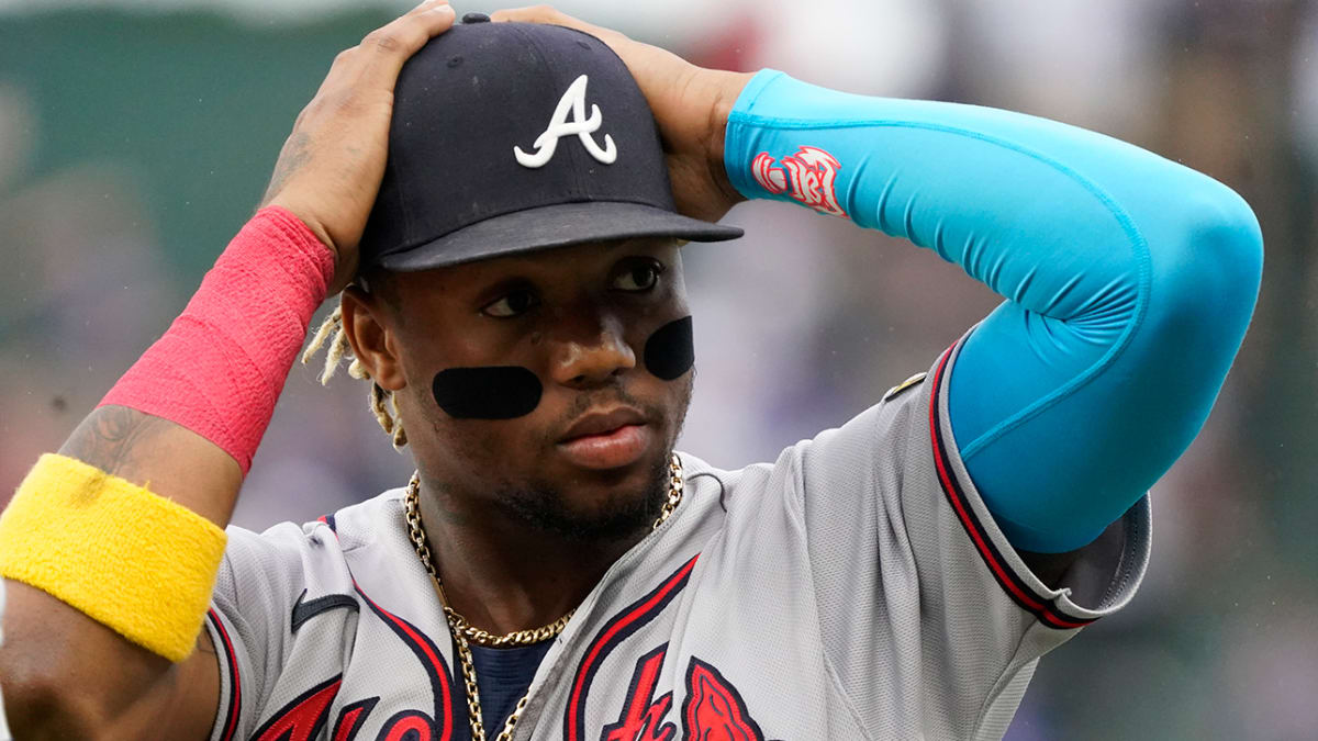 Atlanta Braves outfielder Ronald Acuña Jr. confronted by two fans who  stormed field midgame