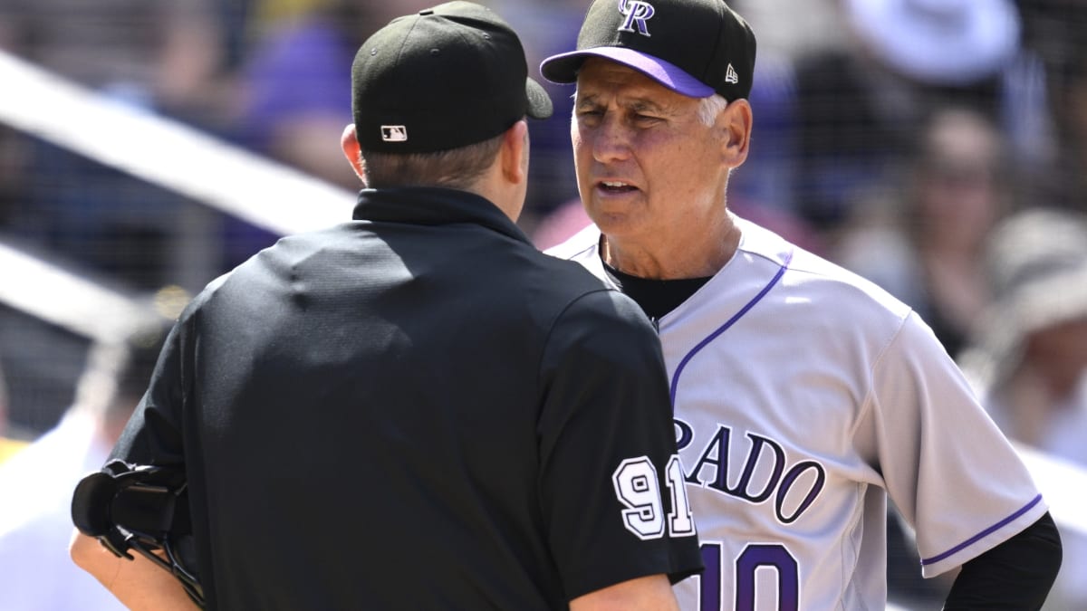 Colorado Rockies fans wave brooms after the team's 3-2 victory