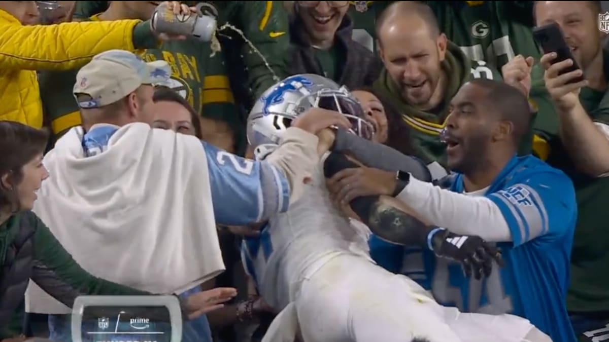 Packers Fan Pours Beer on Amon-Ra St. Brown After Lions TD - Sports  Illustrated