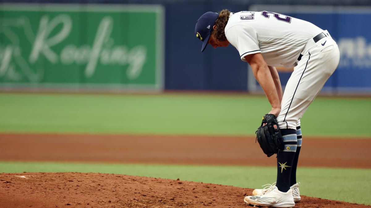 Chapman gets his first victory for Texas as the Rays allow the winning run  on a wild pitch in 9th