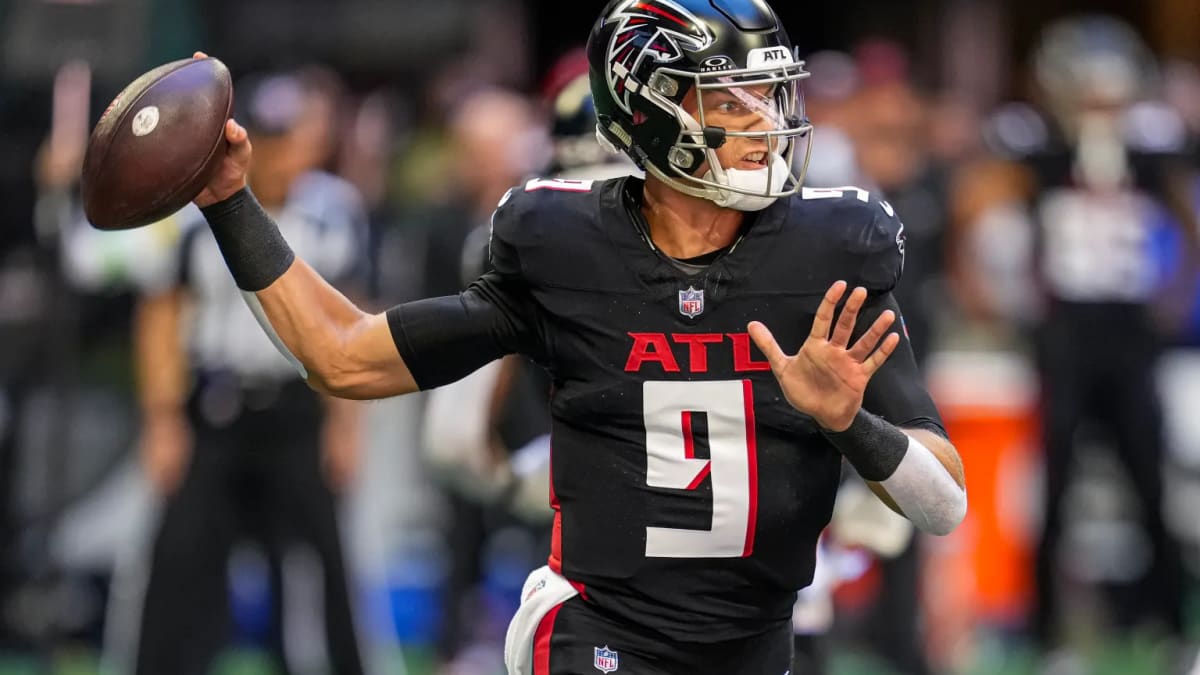 Atlanta Falcons quarterback Desmond Ridder (9) works during the first half  of an NFL football game