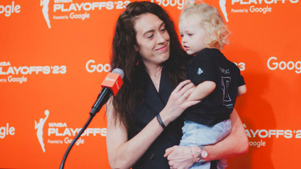 Breanna Stewart holds her first child Ruby after accepting the 2023 WNBA MVP Award