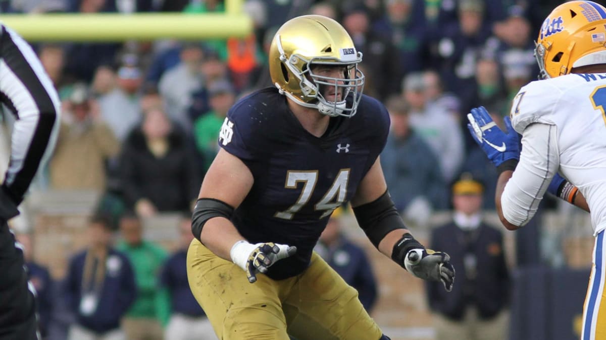 Liam Eichenberg of the Miami Dolphins walks off the field after a News  Photo - Getty Images