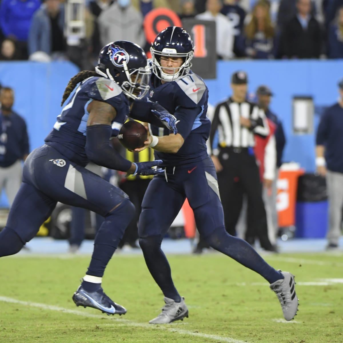 Tennessee Titans quarterback Ryan Tannehill (17) hands off to Trunning back  Derrick Henry (22) during the first half of an NFL Divisional Playoff game  at Nissan Stadium in Nashville, Tennessee, on Saturday