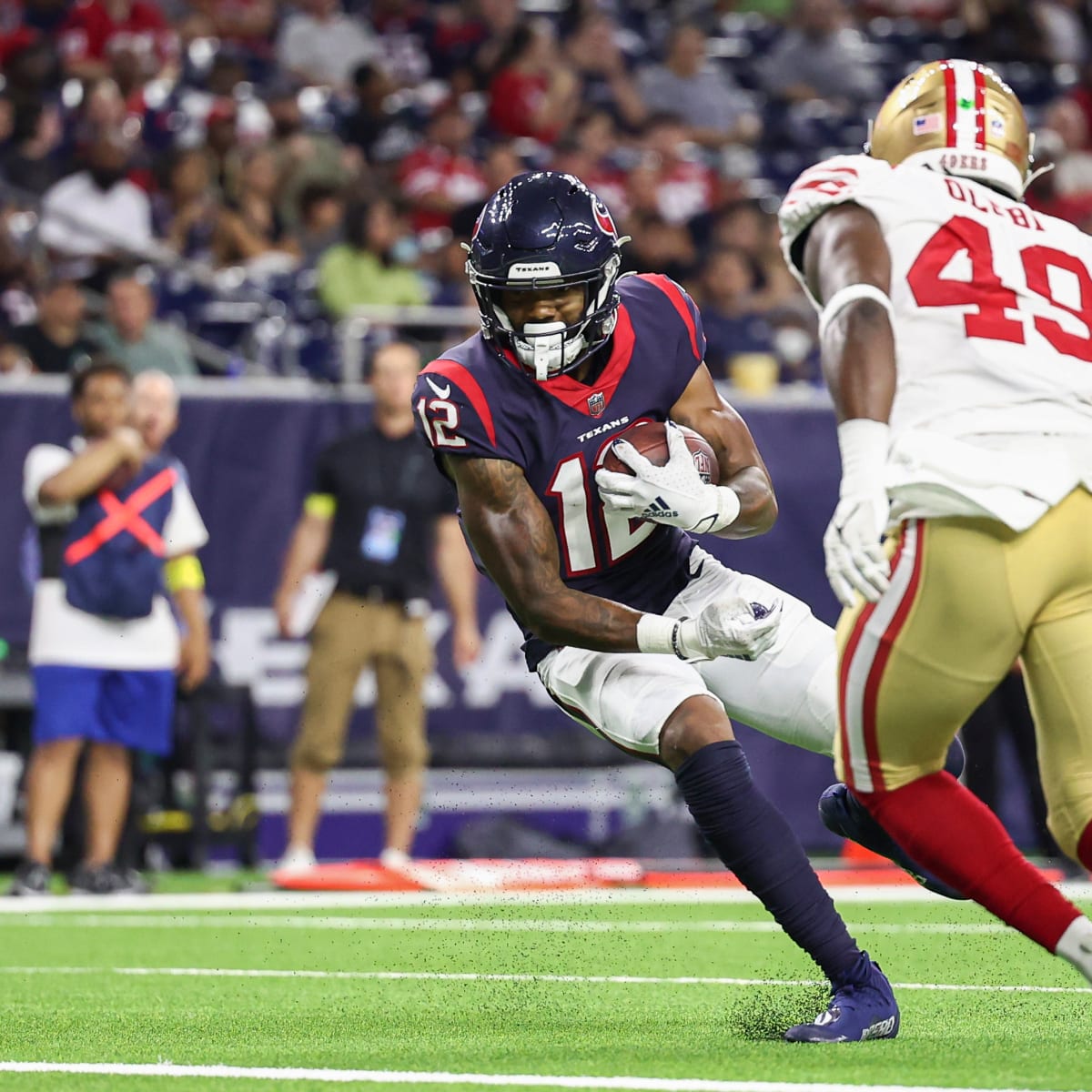 HOUSTON, TX - NOVEMBER 20: Houston Texans wide receiver Nico Collins (12)  holds on to the ball