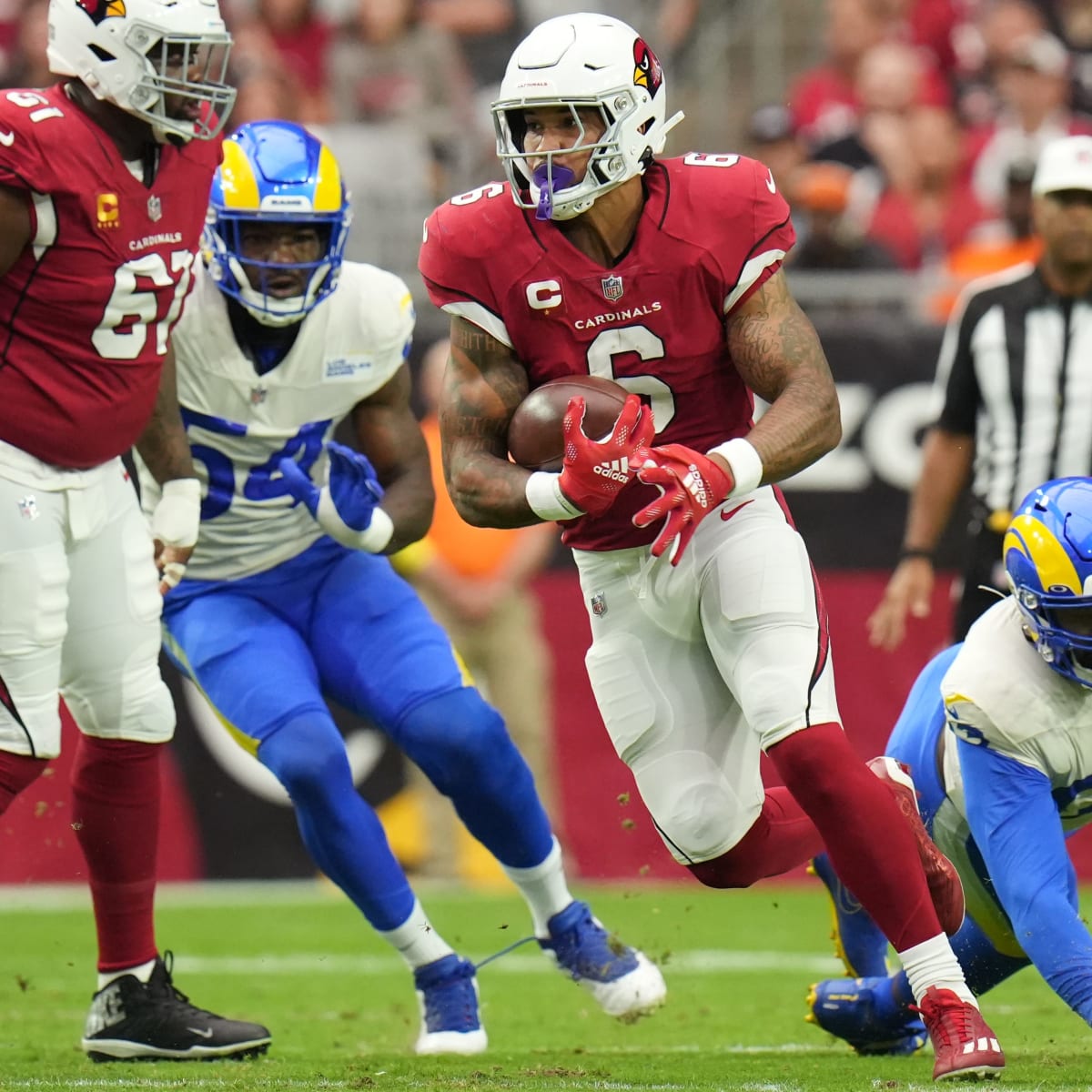 Arizona Cardinals' James Conner smiles as he heads off the field after the  team beat the Seattle Seahawks in an NFL football game, Sunday, Nov. 21,  2021, in Seattle. The Cardinals won