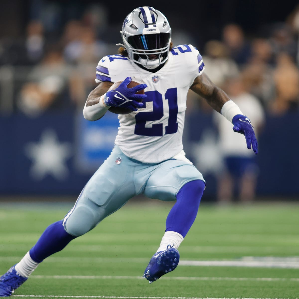 Dallas Cowboys running back Ezekiel Elliott (21) stands on stands against  the Denver Broncos in the first half of an NFL football game Sunday, Aug  13, 2022, in Denver. (AP Photo/Bart Young