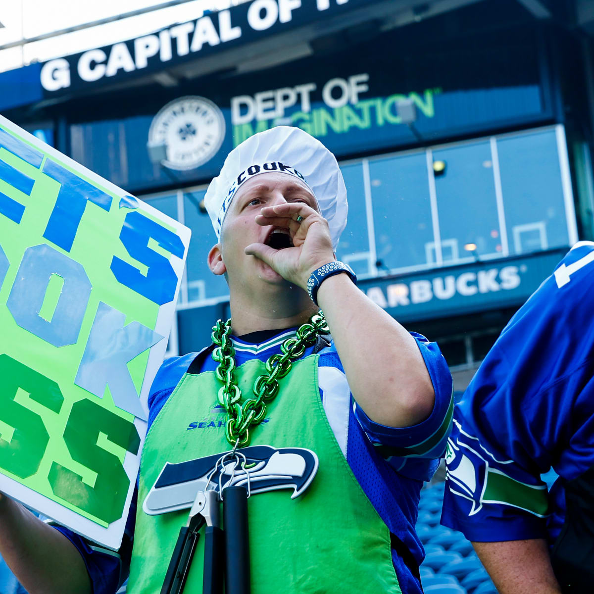 A Seattle Seahawks fan wearing a Russell Wilson jersey waves a towel next  to a Denver Broncos fan wearing a Russell Wilson jersey before an NFL  football game, Monday, Sept. 12, 2022