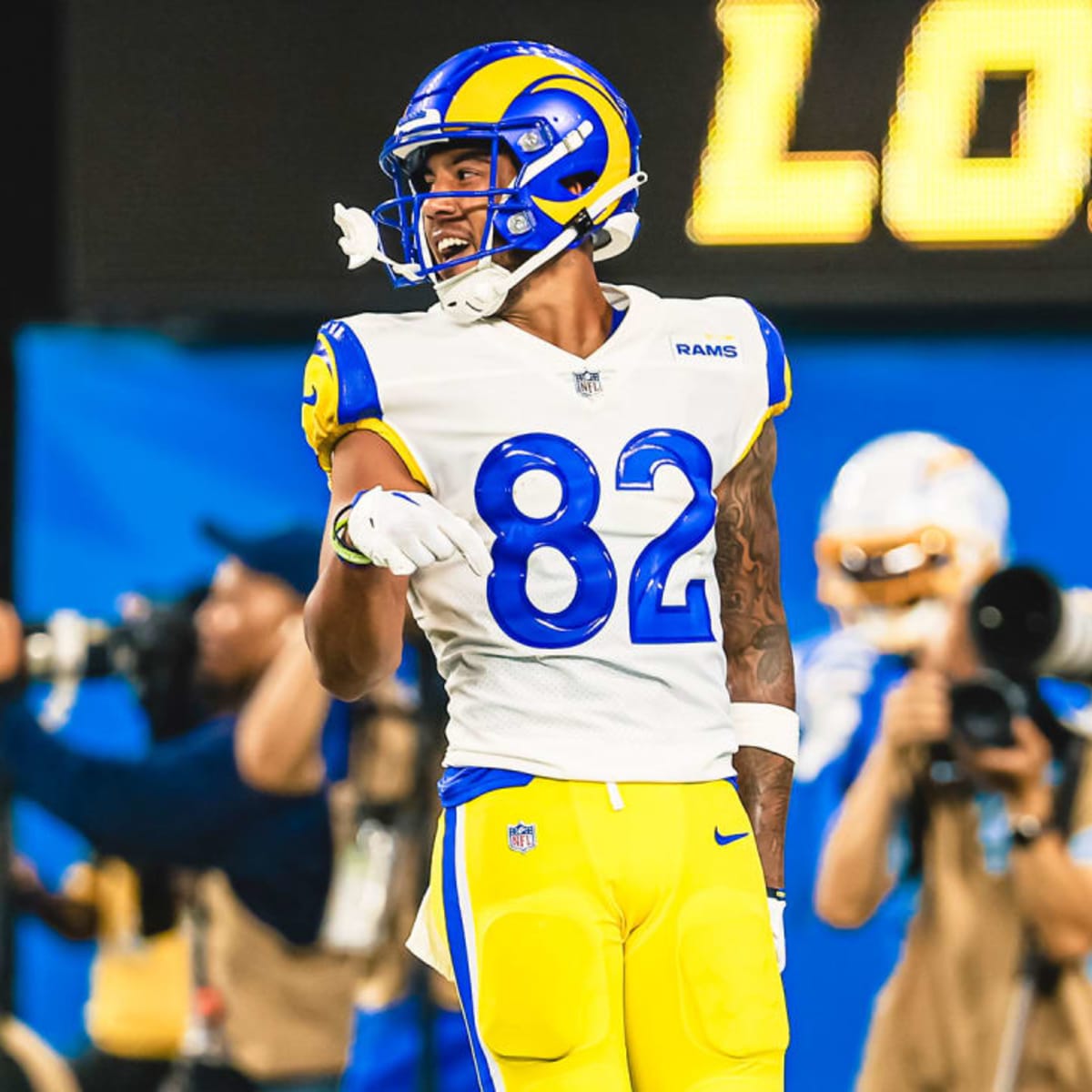 Los Angeles Rams quarterback Bryce Perkins (16), top, leaps over Los  Angeles Chargers defensive back Kemon