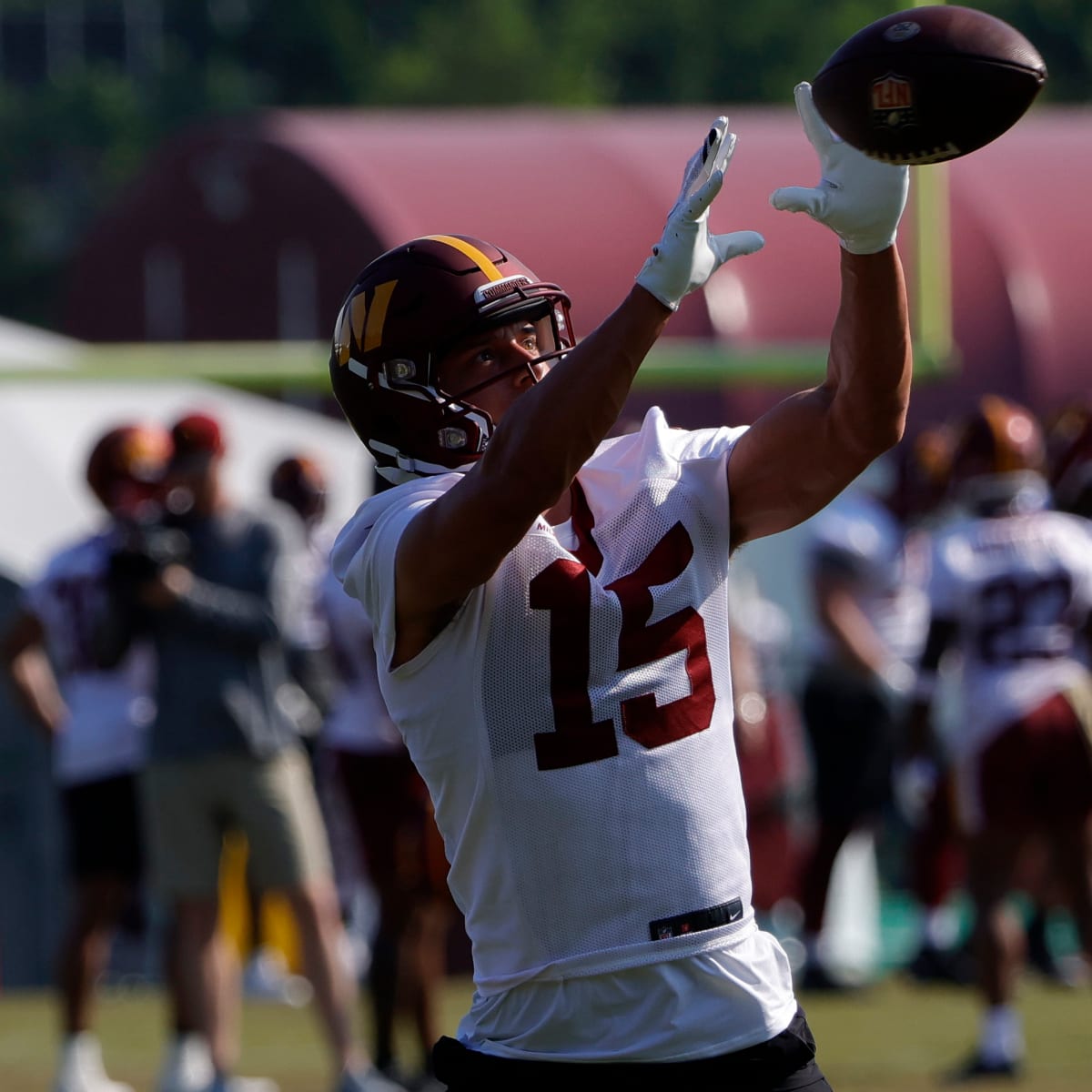 Washington Commanders wide receiver Dax Milne (15) catches the ball during  a NFL football practice at the team's training facility, Wednesday, July  26, 2023 in Ashburn, Va. (AP Photo/Alex Brandon Stock Photo - Alamy