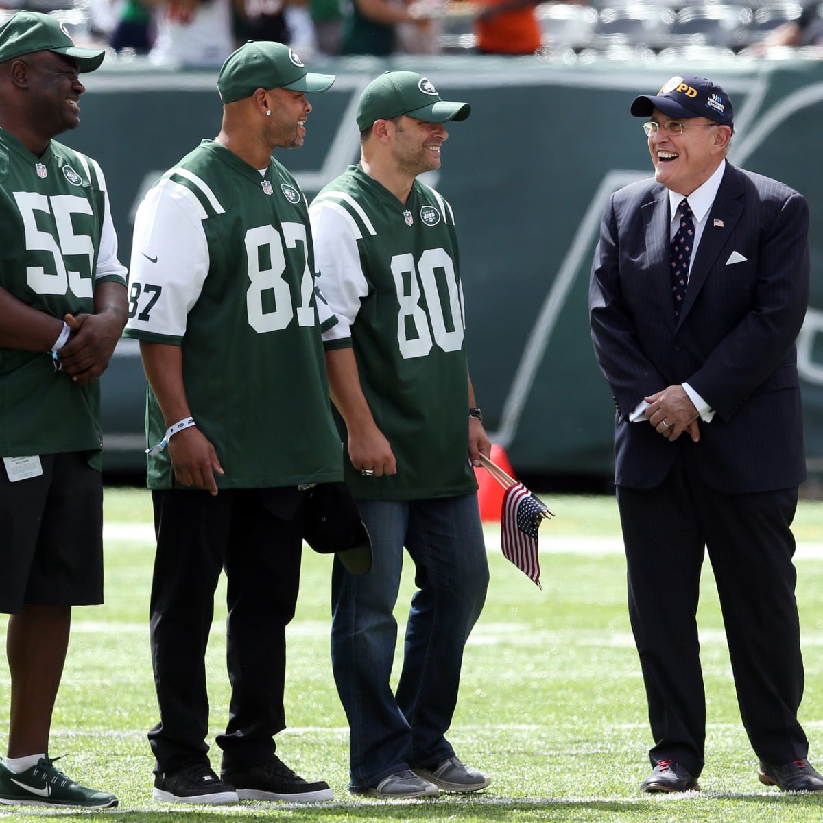 New York Jets wide receiver Wayne Chrebet puts his hands in the air while  being honored during half time of the Miami Dolphins, New York Jets game at  Giants Stadium in East