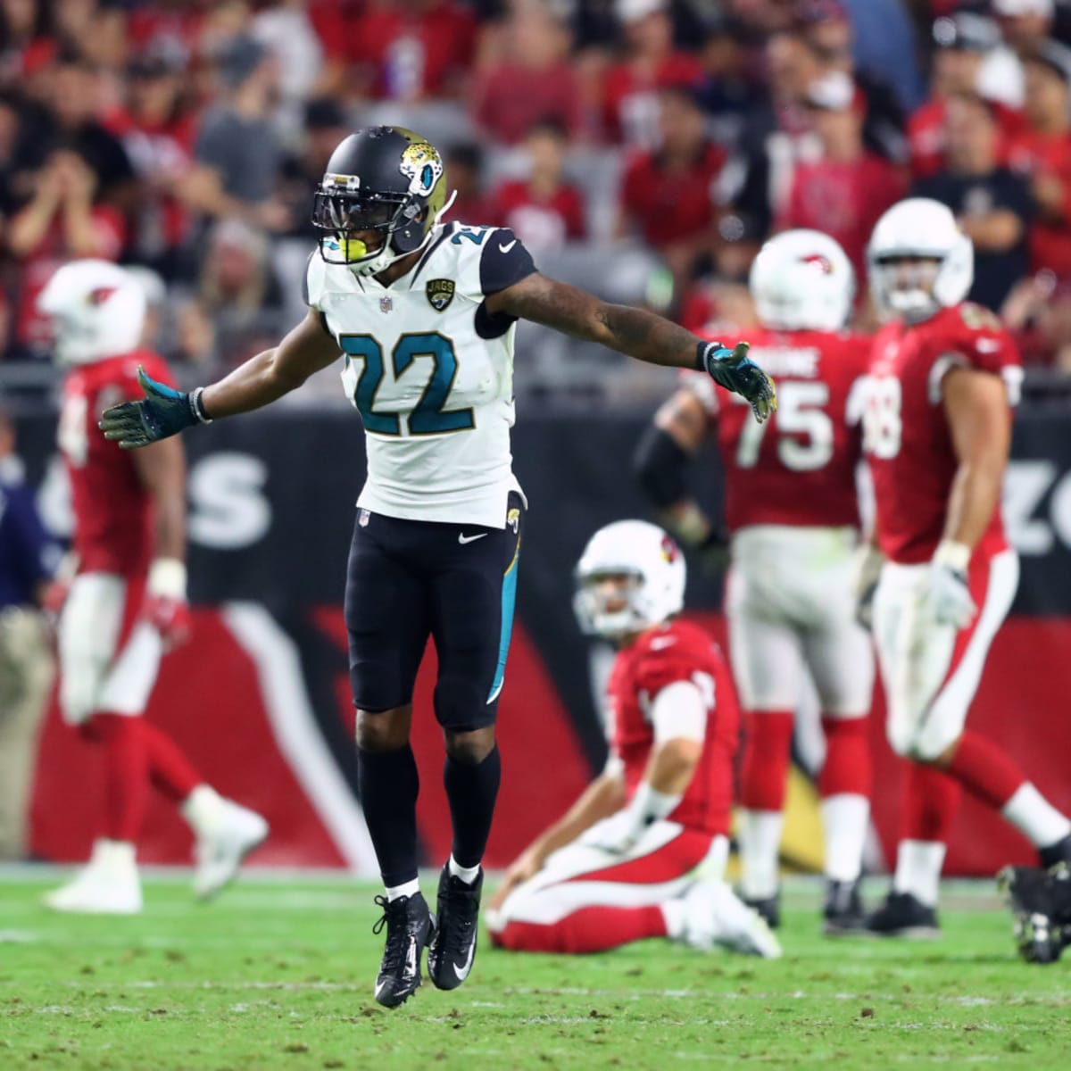 Jacksonville Jaguars cornerback Aaron Colvin (22) smiles as he runs off the  field following the Jaguars 30-9 win against the Pittsburgh Steelers at  Heinz Field in Pittsburgh on October 8, 2017. Photo