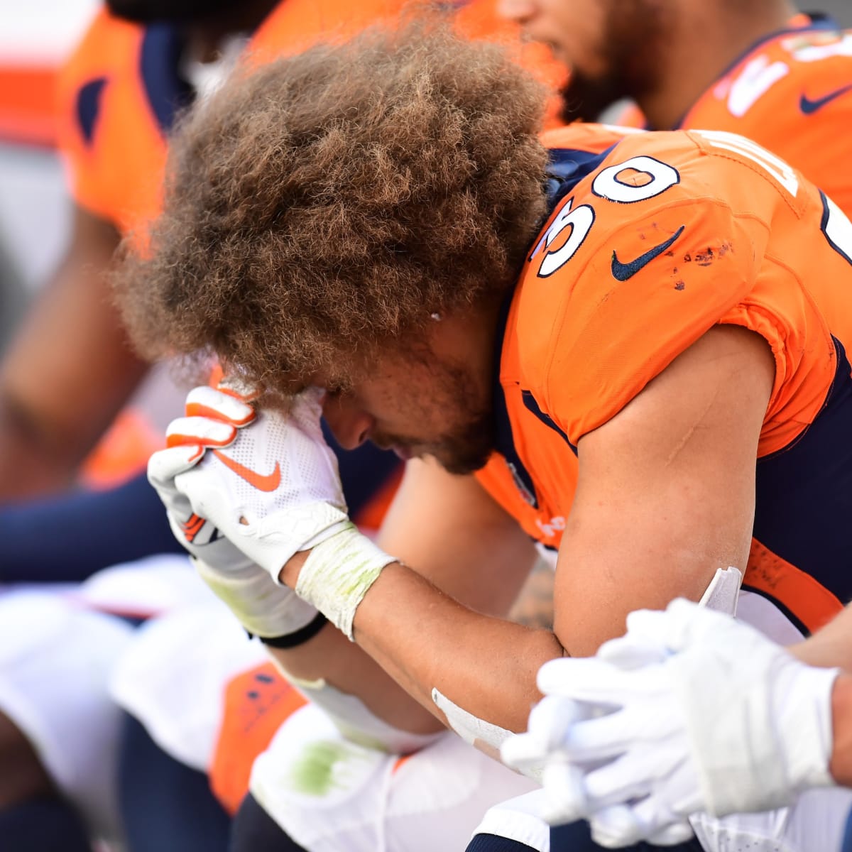 Denver, Colorado, USA. 1st Dec, 2019. Broncos RB PHILLIP LINDSAY starts to  take off his jersey to exchange with a Chargers player during the end of  the game at Empower Field At