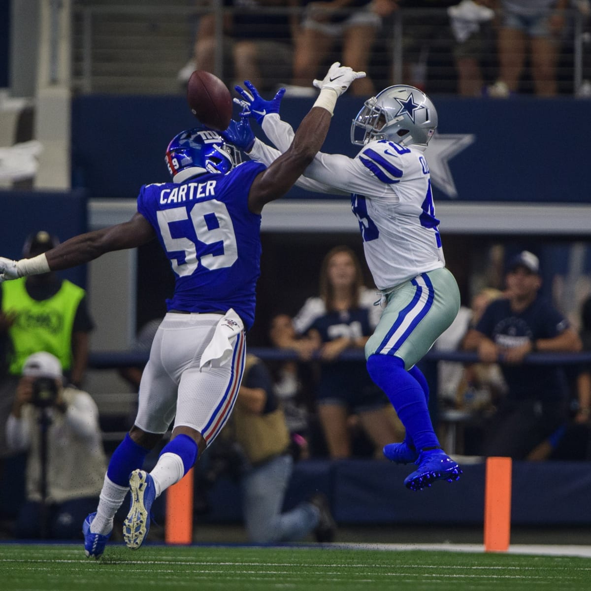 New York Giants outside linebacker Lorenzo Carter (59) reacts after a play  during an NFL football game against the Dallas Cowboys, Sunday, Dec. 19,  2021, in East Rutherford, N.J. (AP Photo/Steve Luciano