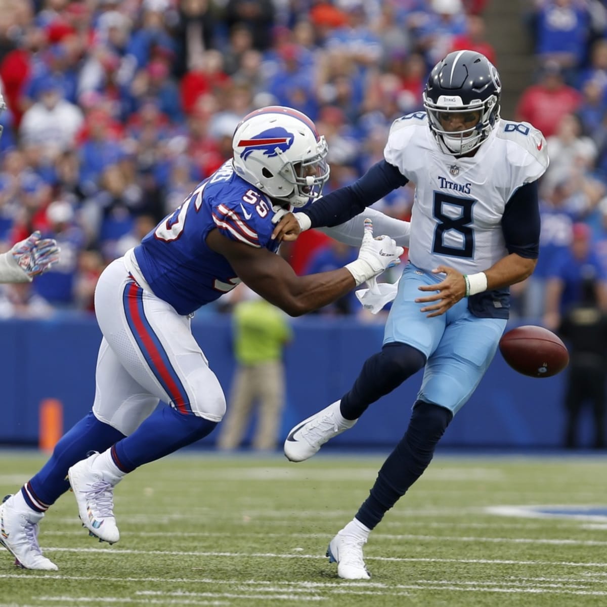 November 05, 2018:.Tennessee Titans quarterback Marcus Mariota (8)  scrambles for a first down during an NFL football game between the  Tennessee Titans and Dallas Cowboys at AT&T Stadium in Arlington, Texas.  Manny