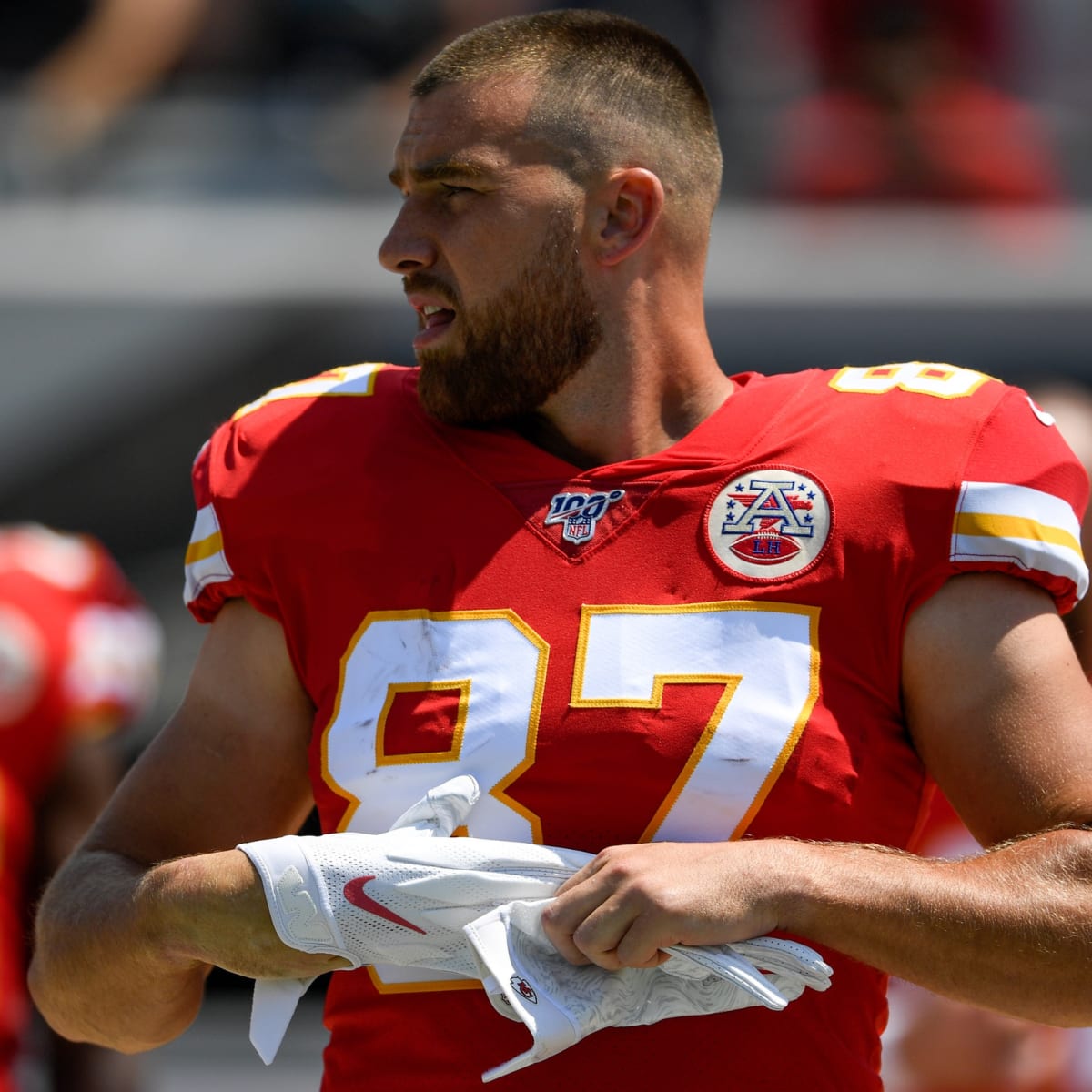 Kansas City Chiefs offensive coordinator Eric Bieniemy talks to Chiefs  tight end Travis Kelce (87) after their win over the Buffalo Bills in an  NFL divisional playoff football game, Sunday, Jan. 23