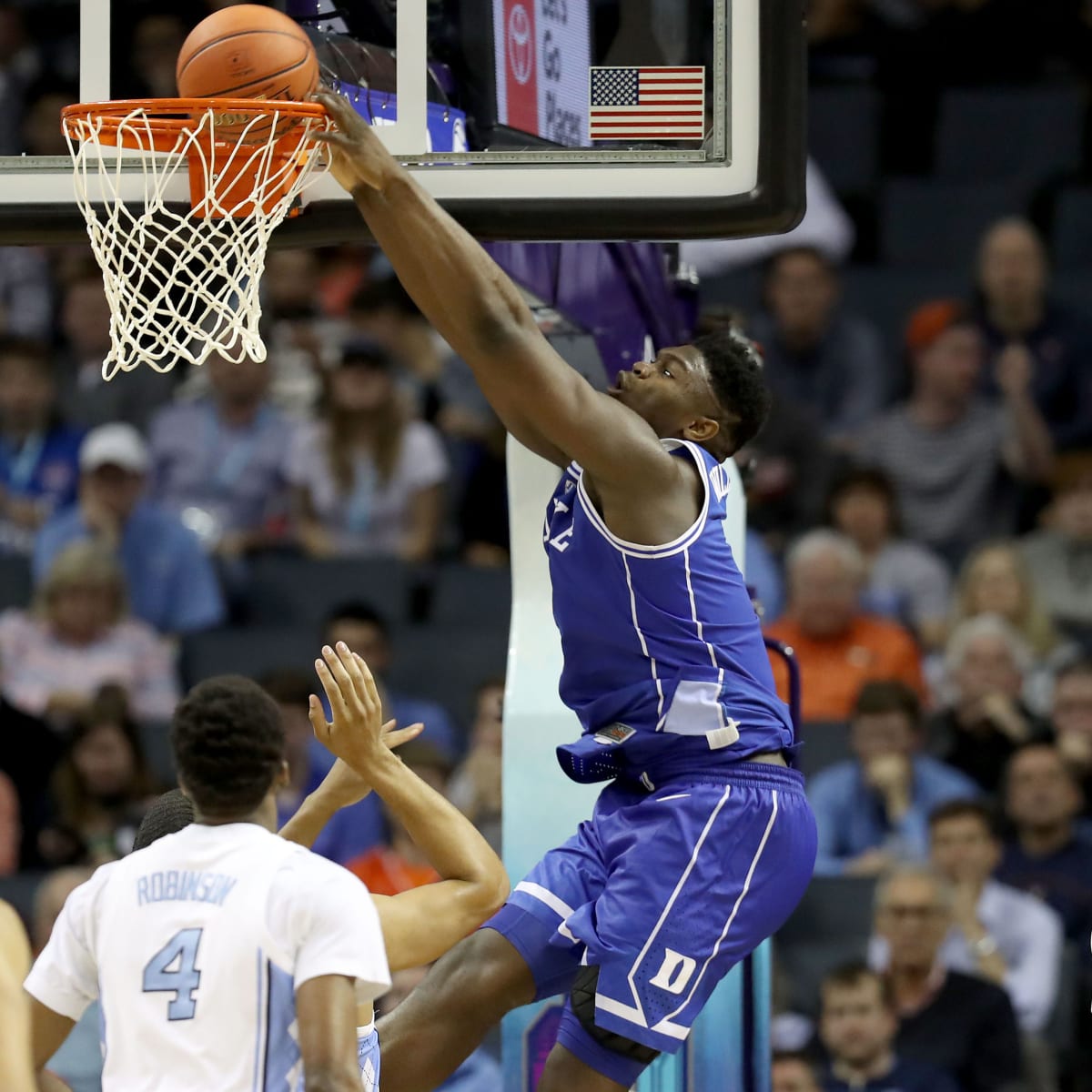 CHARLOTTE, NC - MARCH 16: Duke Blue Devils forward RJ Barrett (5) dunks  while Duke Blue Devils forward Zion Williamson (1) celebratess during the  2nd half of the ACC Tournament championship game