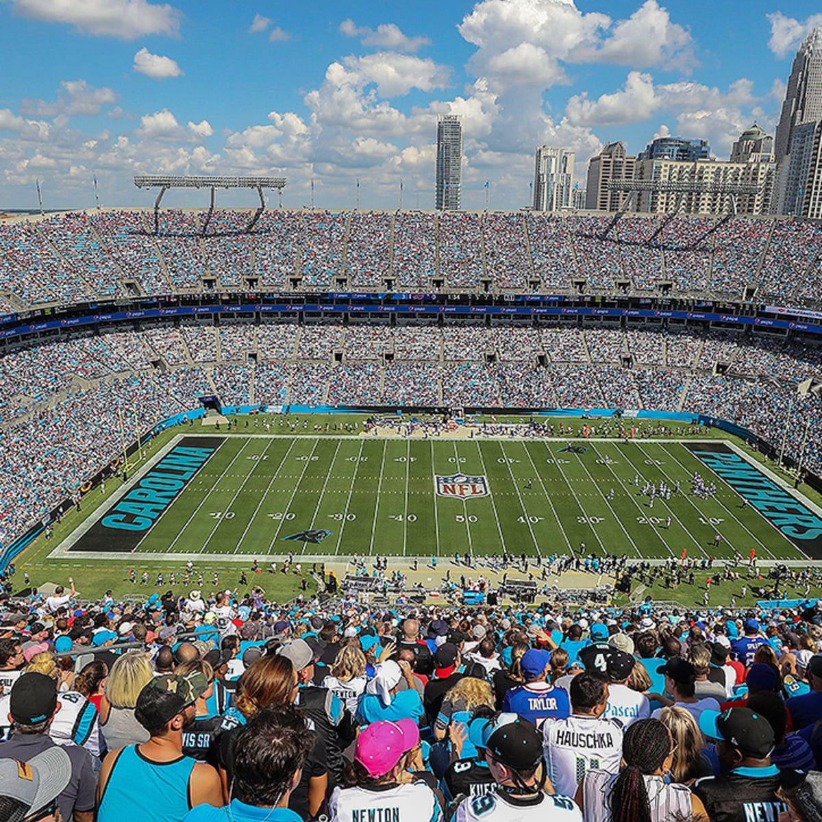 Carolina Panthers players push owner David Tepper for grass field