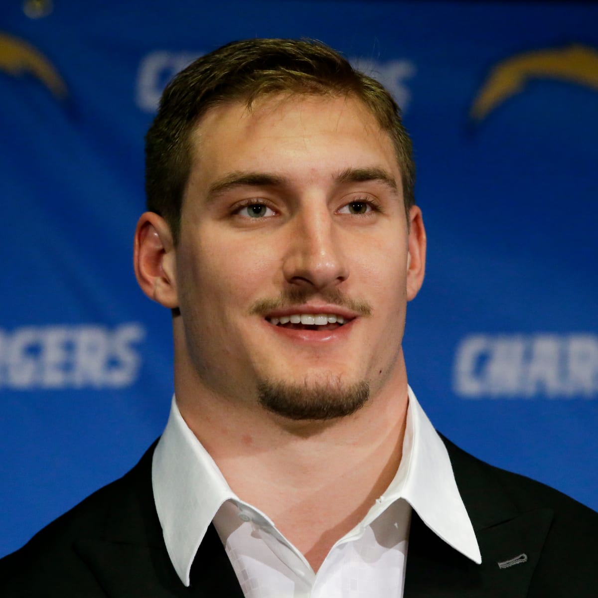 John Bosa, who played for the Miami Dolphins, talks to the media Friday,  April 29, 2016, in San Diego, the day after the San Diego Chargers selected  his son Joey Bosa in