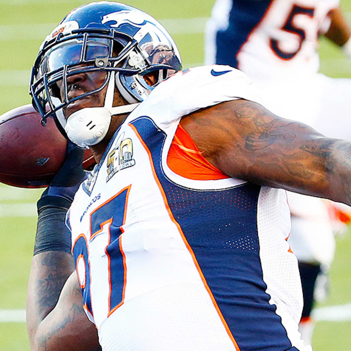 Photo: Denver Broncos' Corey Nelson hugs the Lombardi trophy after