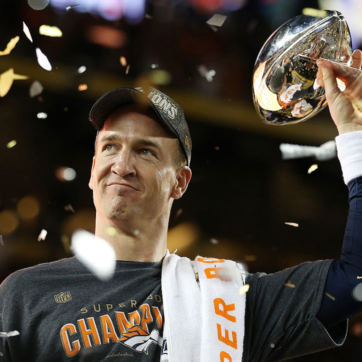 Eli Manning looks far from impressed as brother Peyton wins Super
