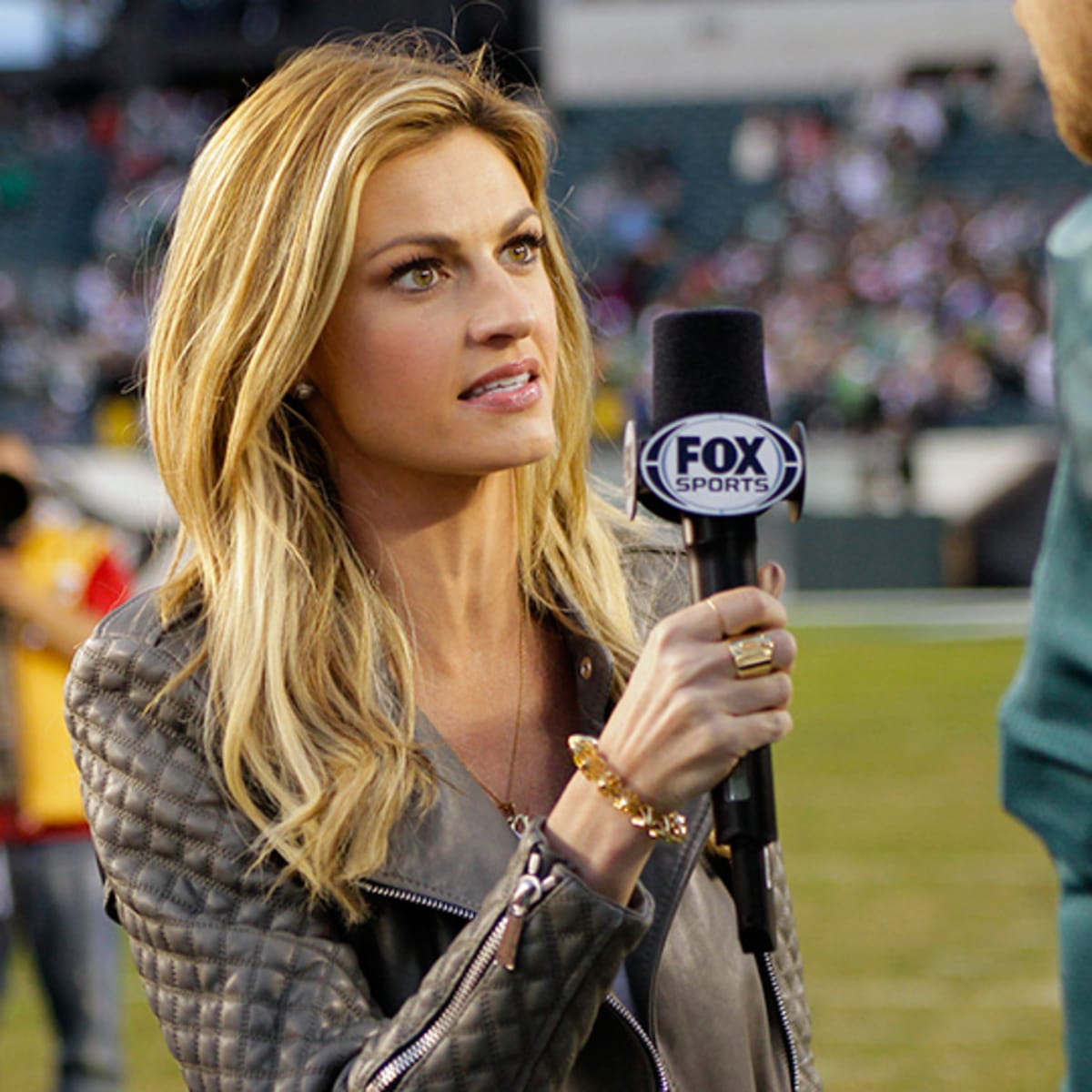 Fox Sports Network broadcaster Erin Andrews, left, embraces New