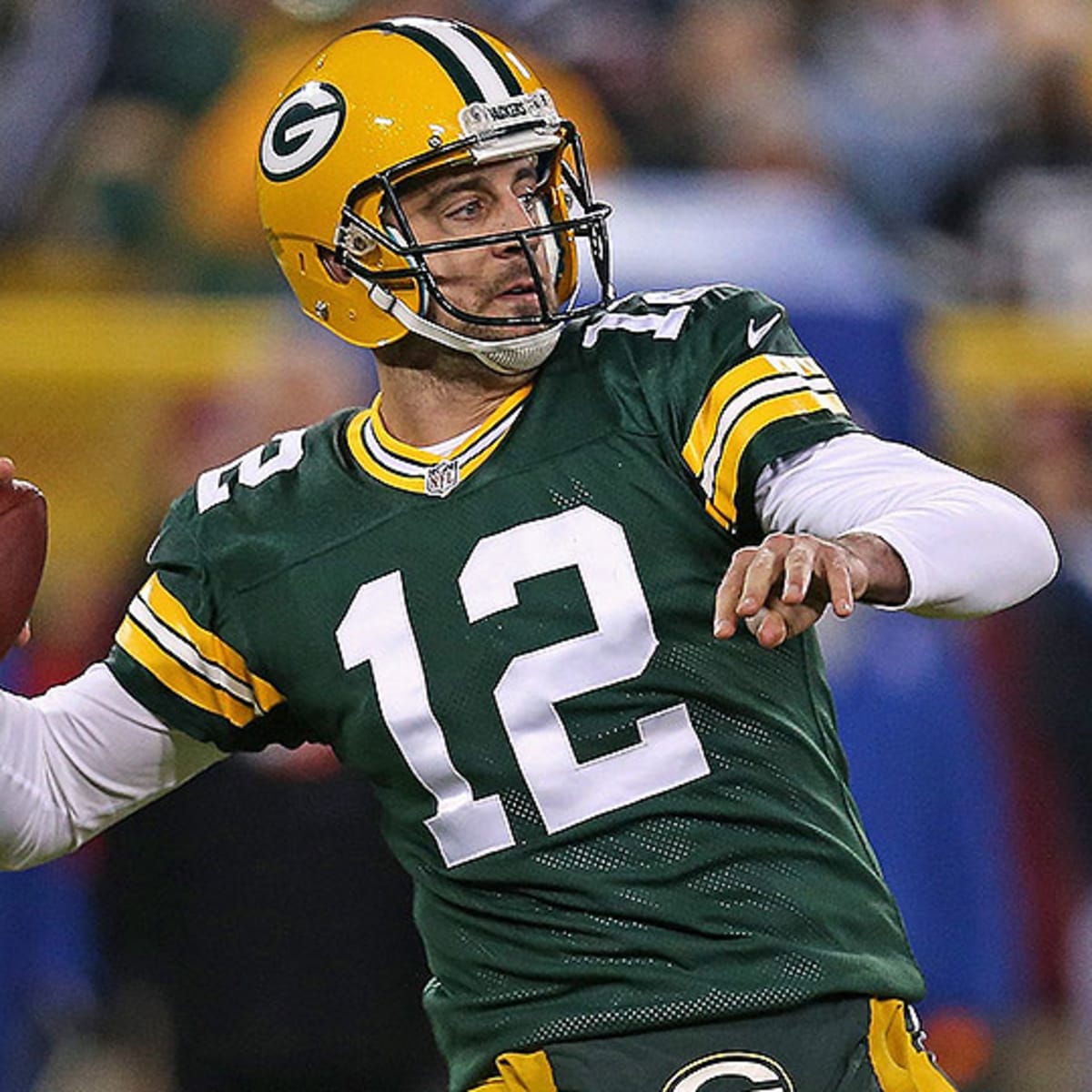 Green Bay Packers quarterback Aaron Rodgers hugs his mother Darla Rodgers  before taking the…