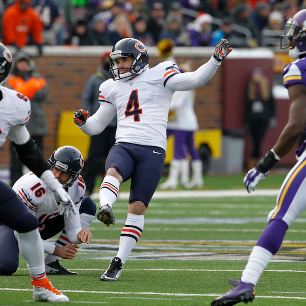 Chicago Bears quarterback Jay Cutler (6) trips over Detroit Lions defensive  tackle Andre Fluellen (96) after throwing a pass during the third quarter  at Soldier Field in Chicago on November 10, 2013.