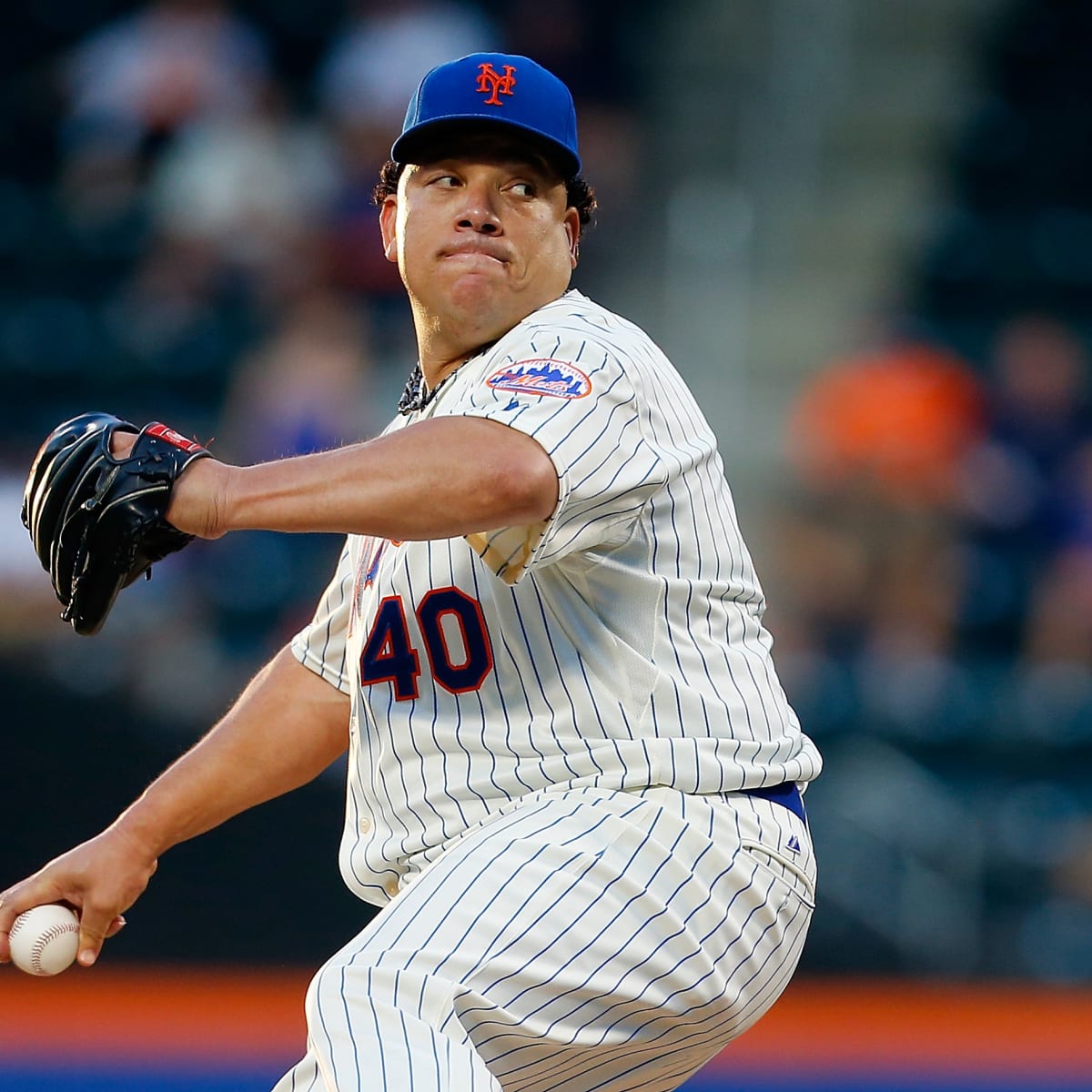 Oakland A's pitcher Bartolo Colon throws to the Seattle Mariners