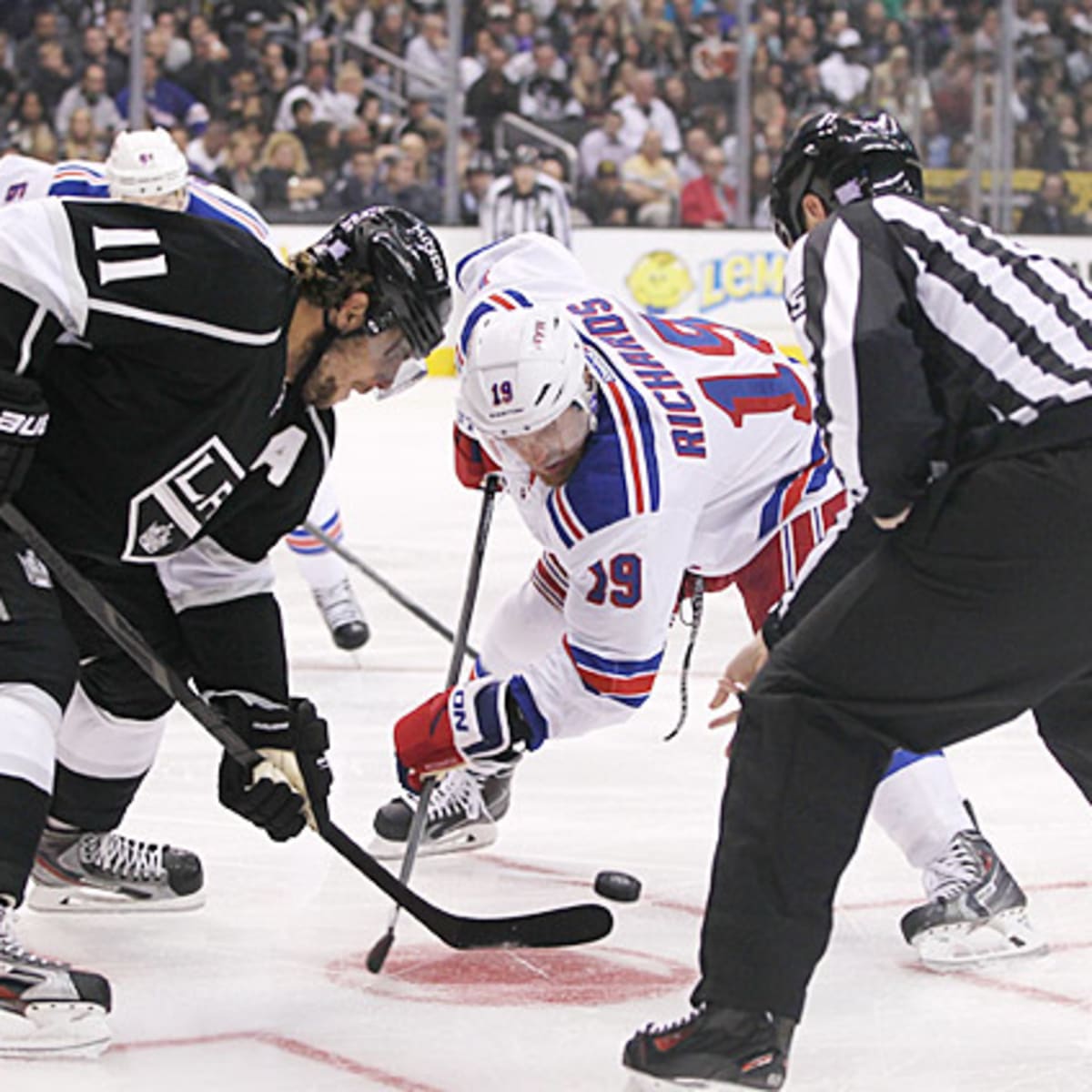 Anze Kopitar and Matt Greene of the Los Angeles Kings react after the
